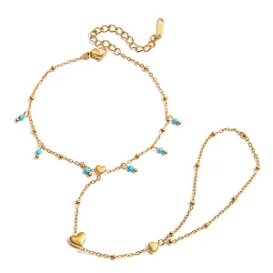 Bijou de main pour femme, acier inoxydable doré à perles turquoise et chaînette cœur, modèle Cigara
